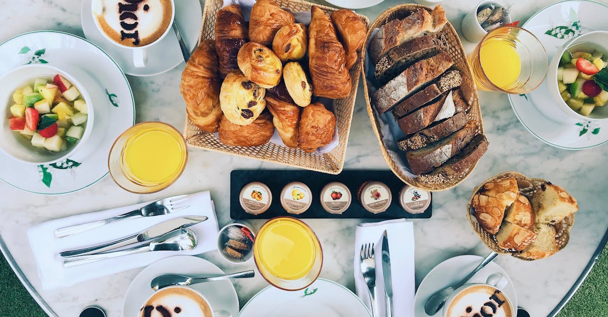 Luxurious French breakfast setup with pastries, coffee, and juice in a stylish setting. Great for lifestyle and food visuals.