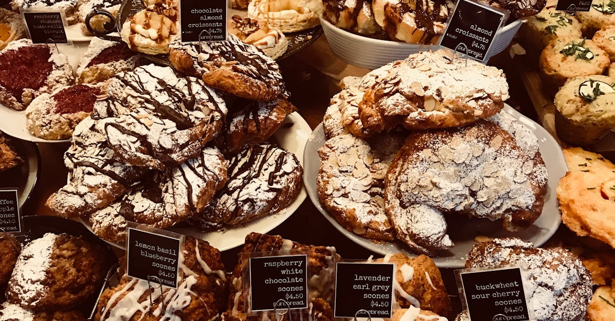 A mouthwatering selection of diverse pastries in a cozy bakery setting.