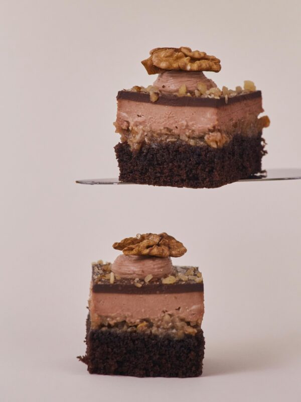 Indulgent chocolate pastry topped with walnuts, perfect for dessert lovers.